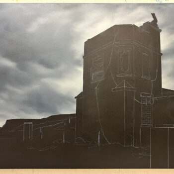 Abandoned weather station against a stormy sky.