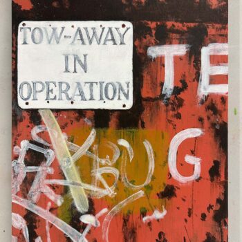 Tow-away sign on rusty red door